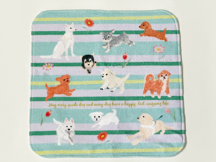 パープルを基調にしたボーダーにお花が散りばめられシェパード盲導犬とラブラドール盲導犬、マルチーズ、ダックス、プードル、シバイヌ、ヨーキー、シュナウザーが描かれたオリジナルタオル