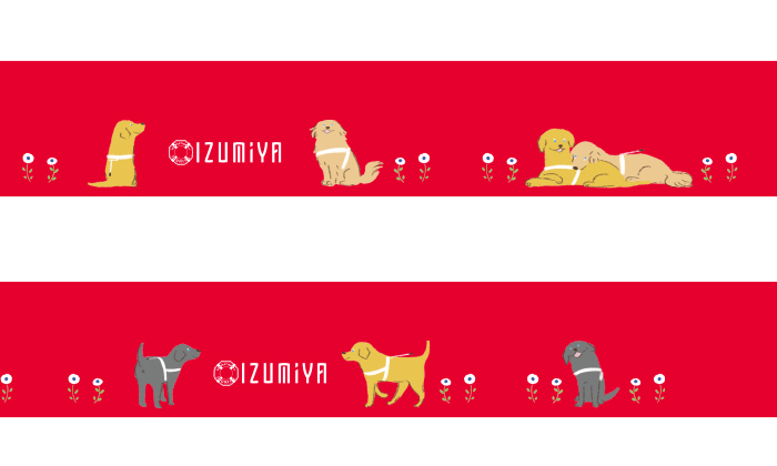 缶の側面のイラストは赤の背景に小花とゴールデン、イエローラブ、ブラックラブの盲導犬がてくてく歩いたり仲良く寄り添ってお昼寝をしているイラスト