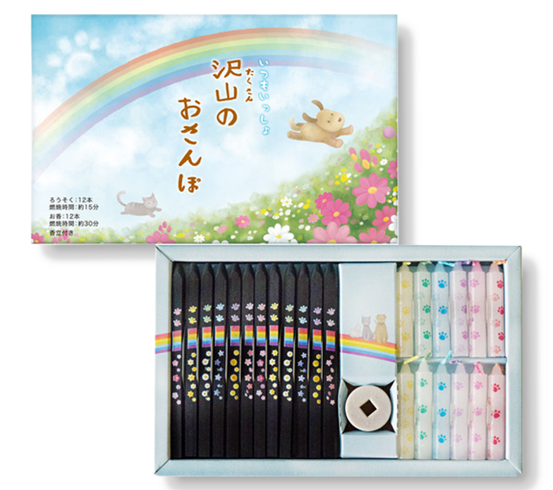 パッケージの写真と中身の写真。黒に虹と花、肉球がカラフルにプリントされている線香12本と小さなろうそくが６色が12本、と線香立てが入ったセット